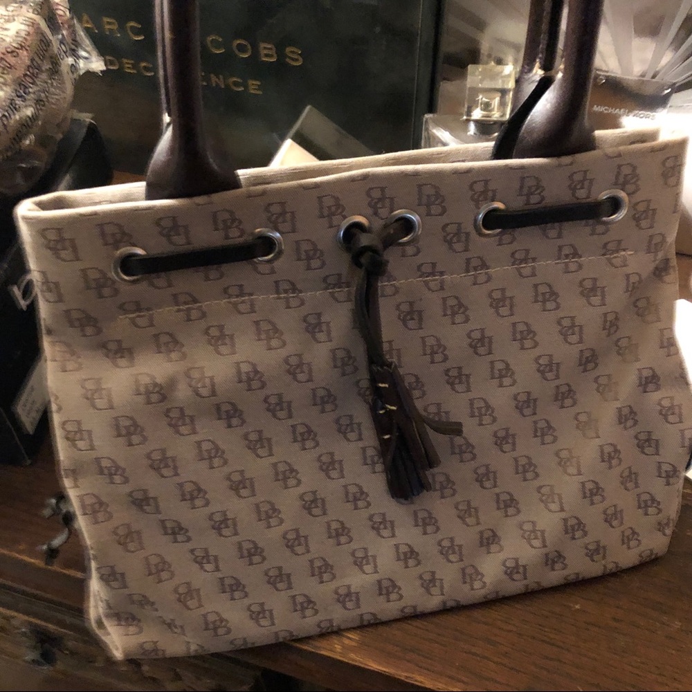 Mini tassels tote. Brown leather handles & tassels